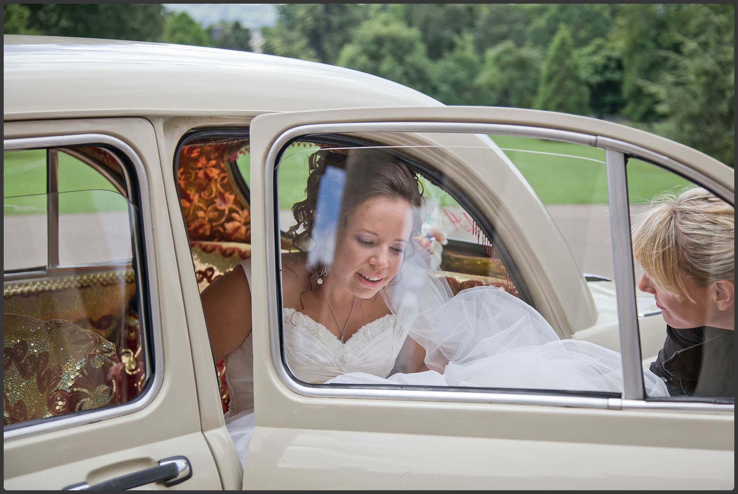 Bride getting out her wedding car