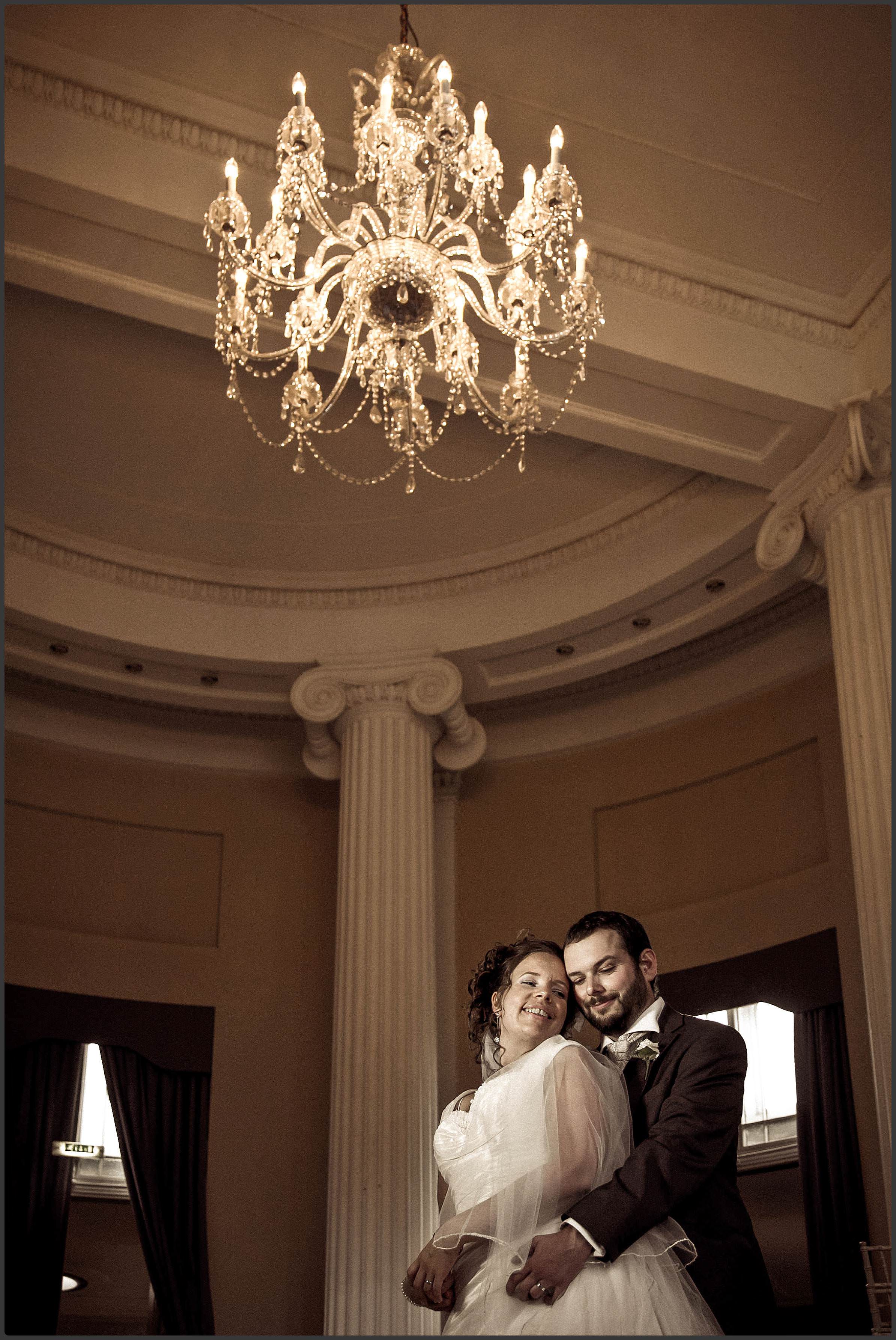 A fine art photo of the bride and groom together in the Pittville Pump rooms