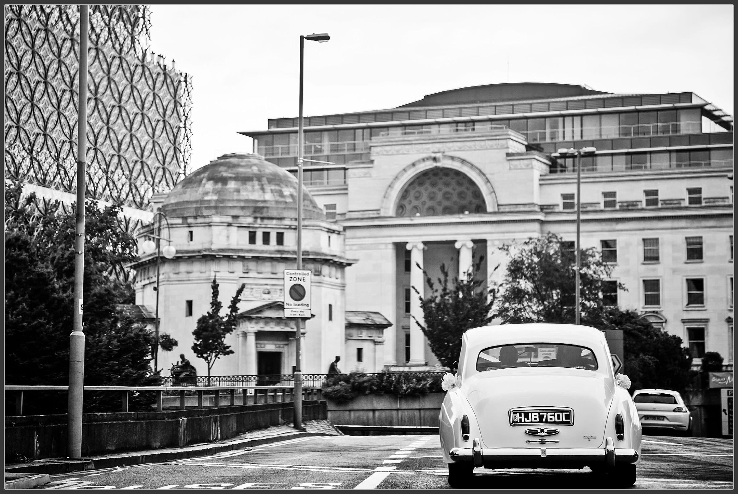 Wedding car driving through Birmingham