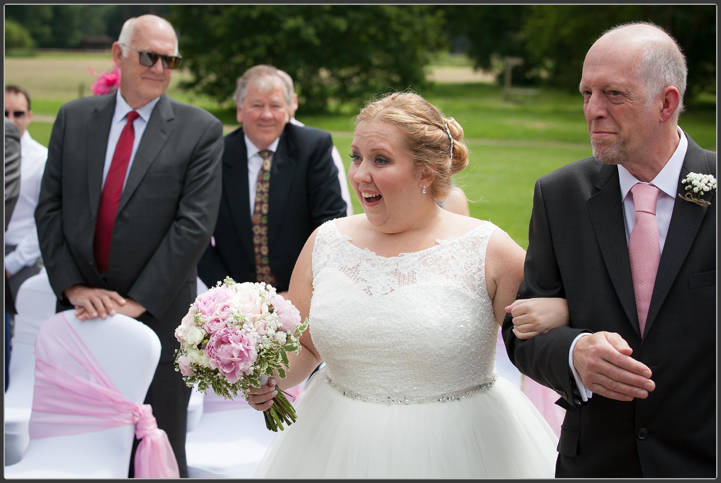 Father and daughter walking down the aisle