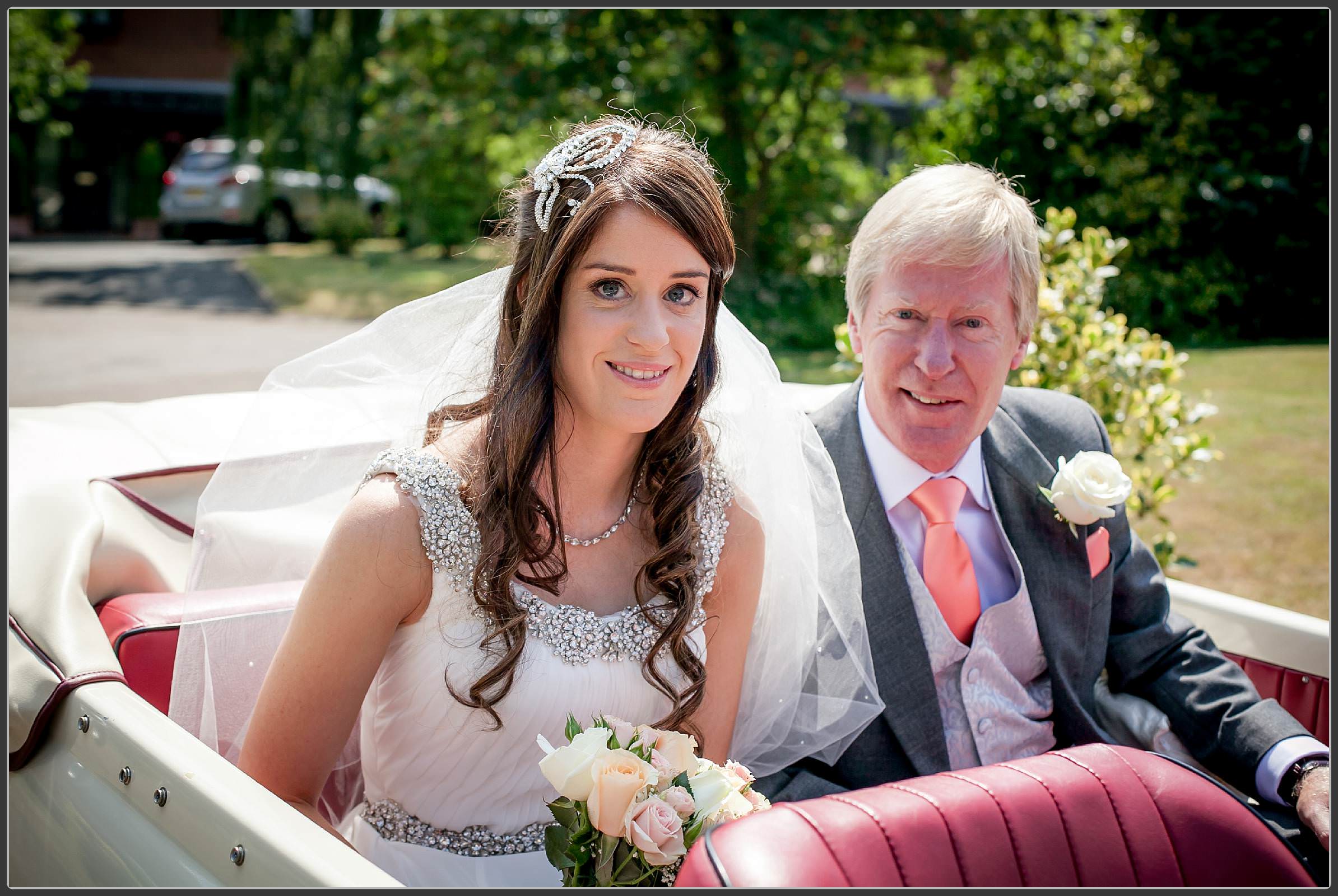 Bride and her father in the wedding car