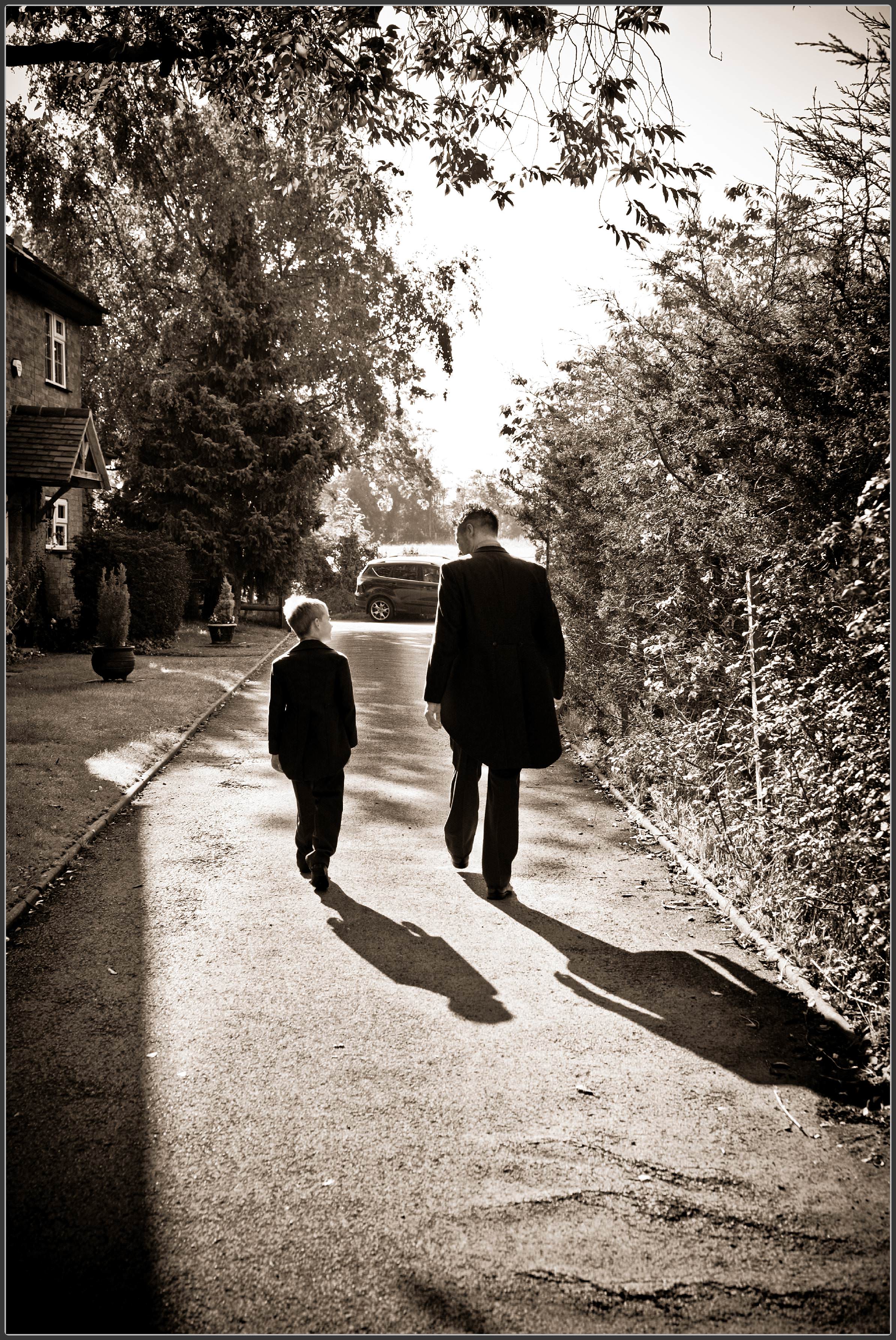 Dad and son walking to church