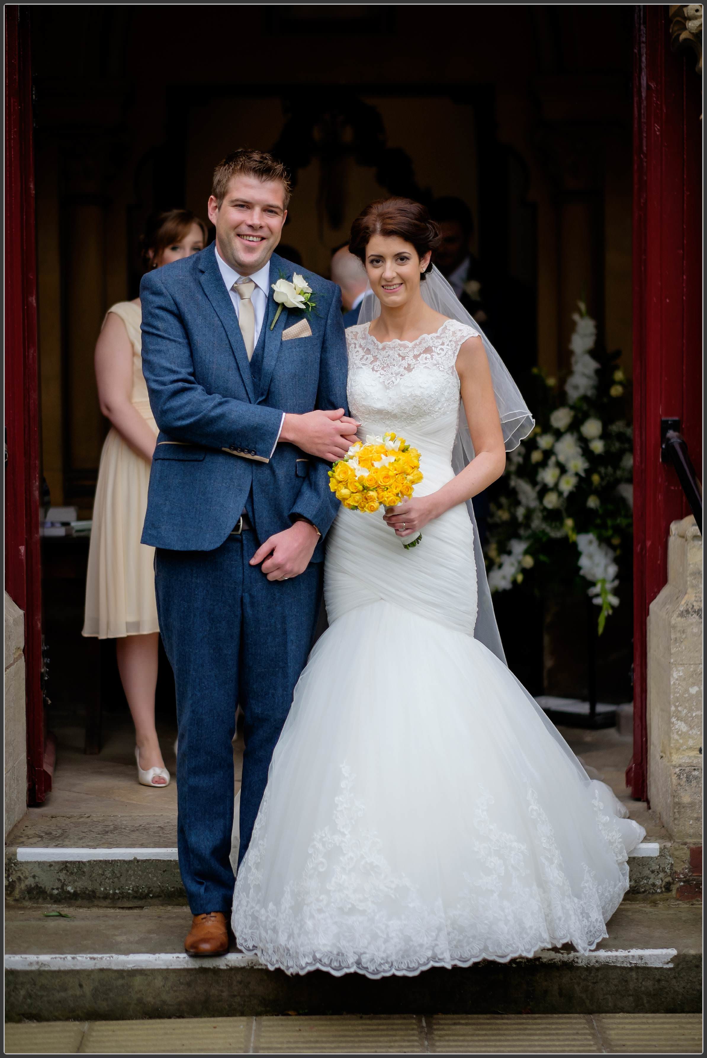 The bride and groom outside the church