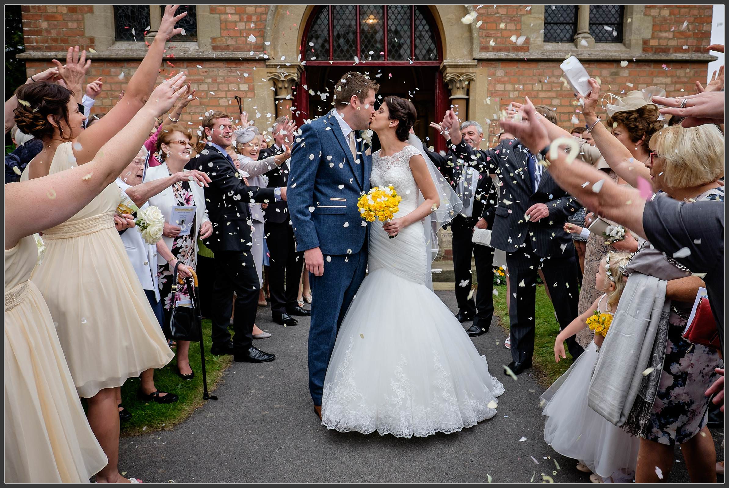 Confetti photo with the bride and groom