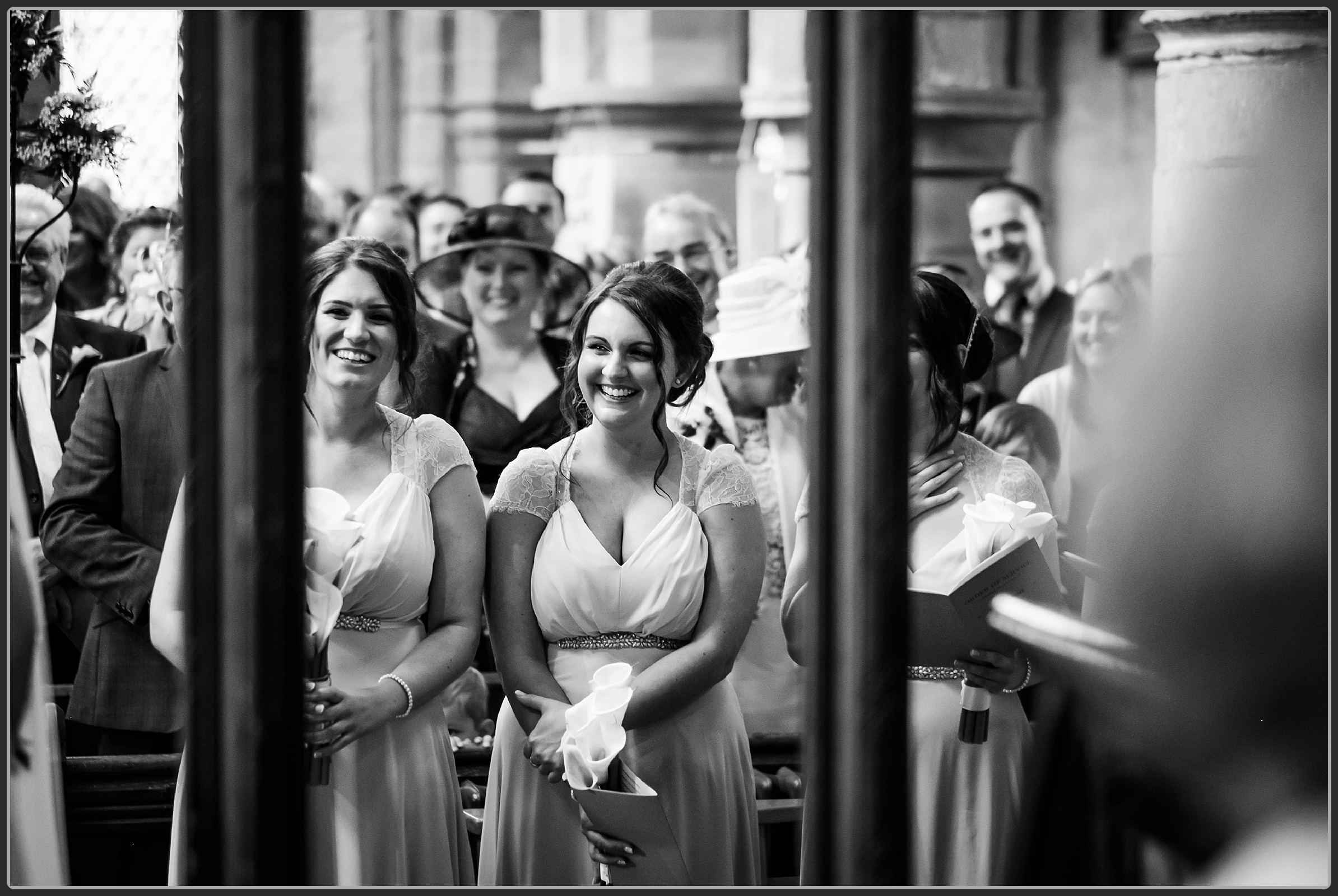 Bridesmaids laughing during the ceremony