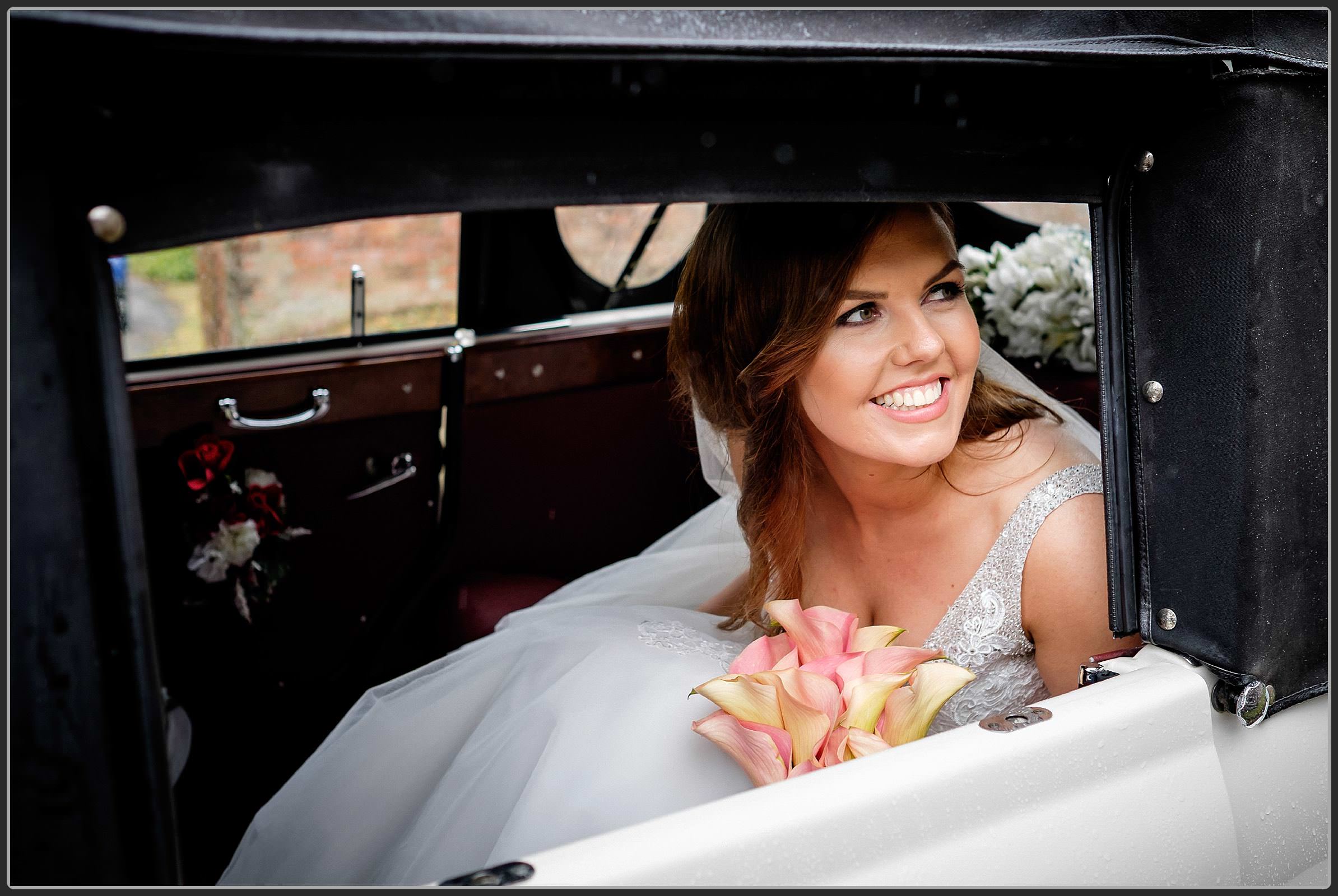 Bride in her wedding car