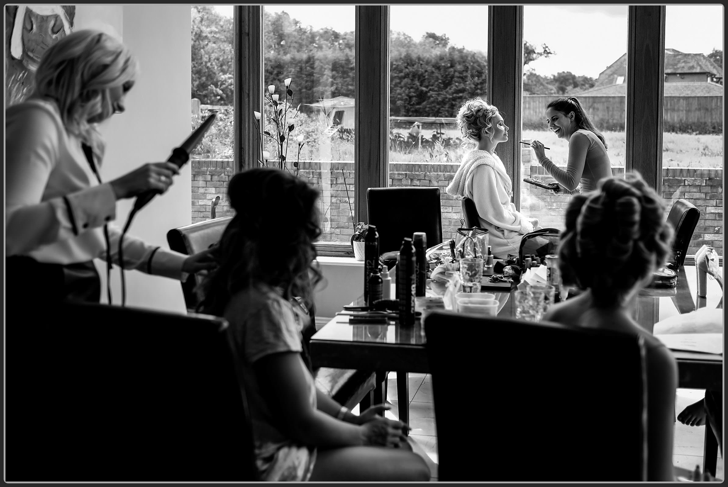 Bride having her makeup finished