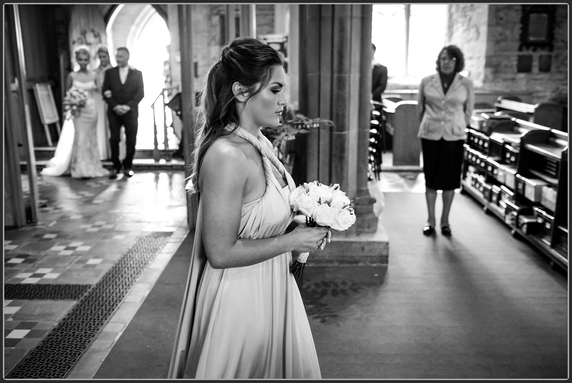 Bridesmaid walking down the aisle