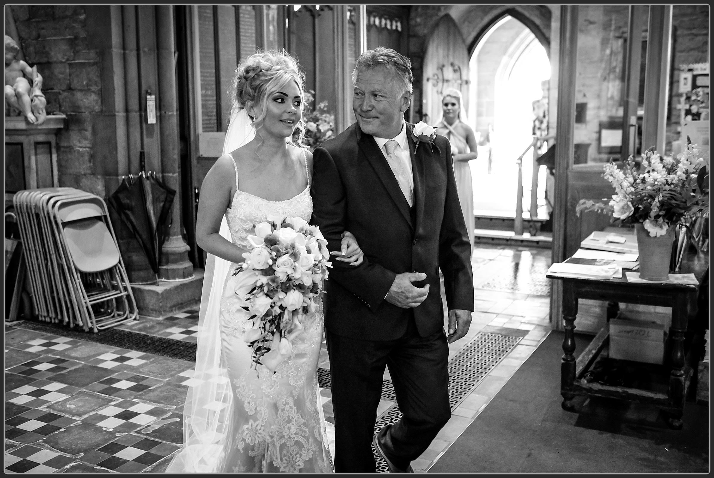 Bride and her father walking down the aisle