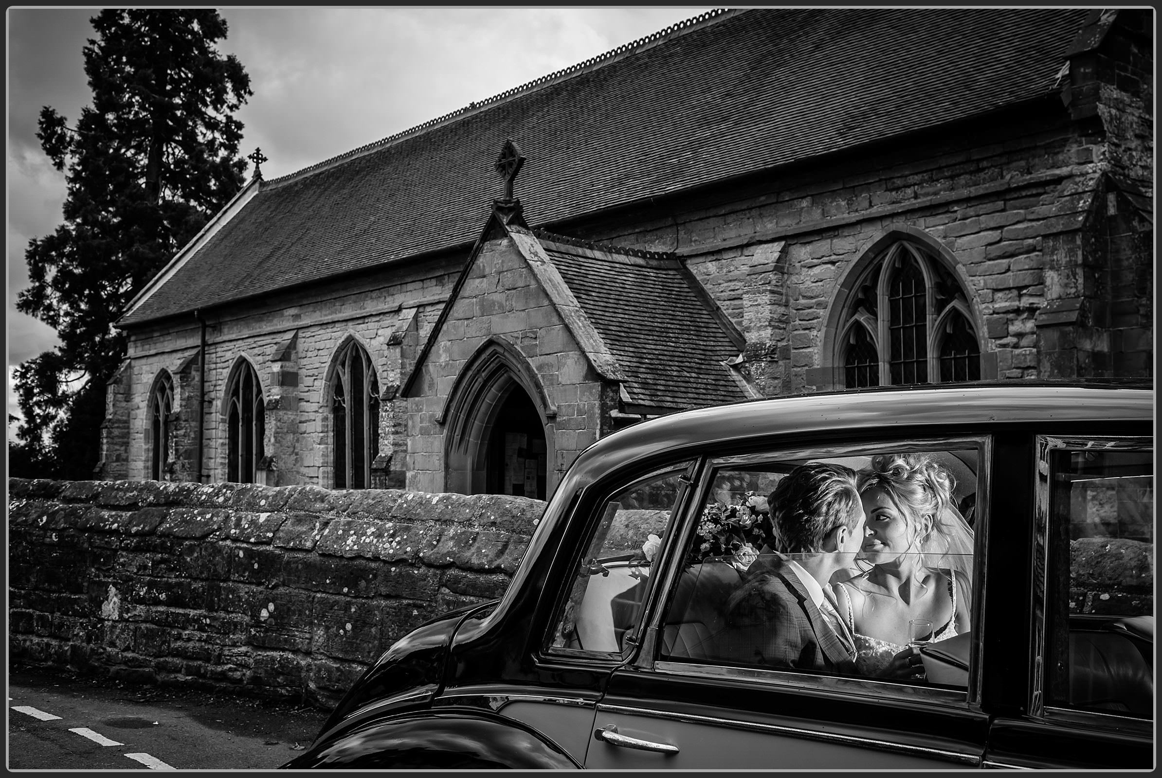 Bride and groom in wedding car