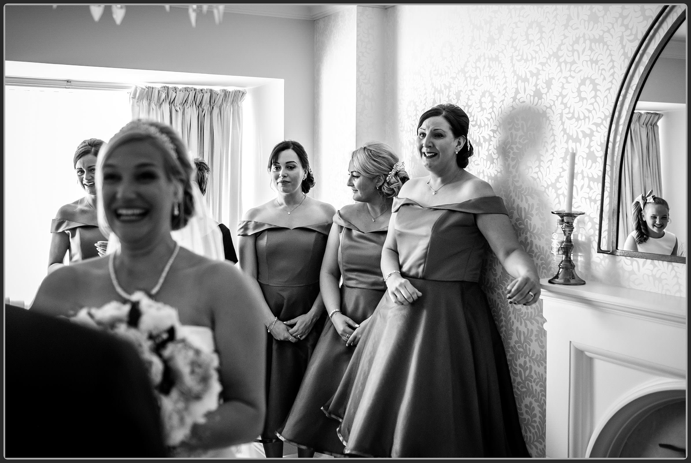 Bridesmaids seeing the brides father's reaction