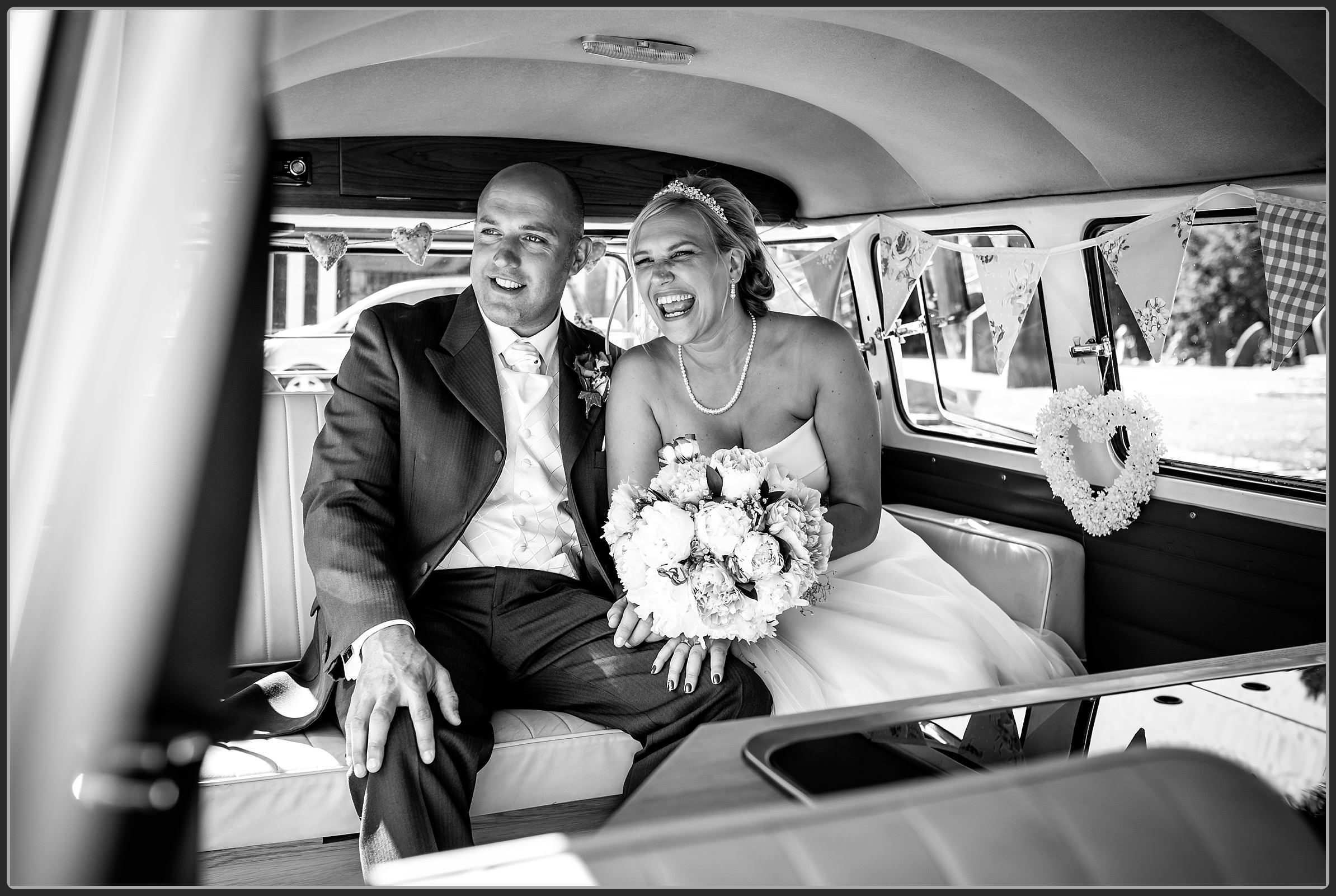 Bride and groom in wedding car