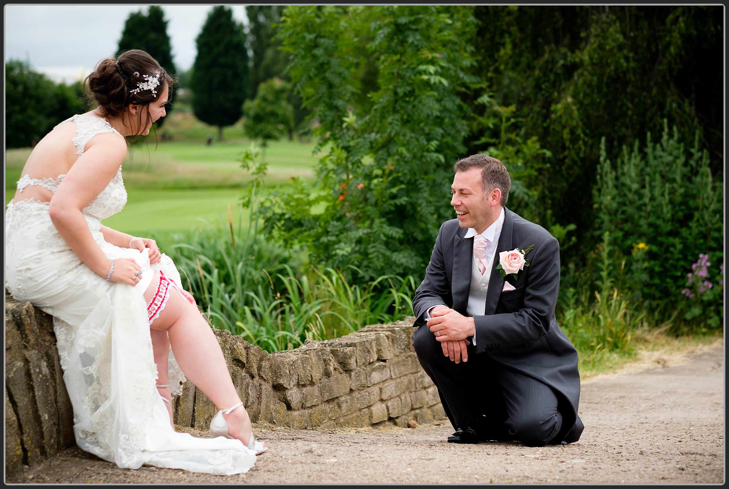 Groom seeing his brides garter