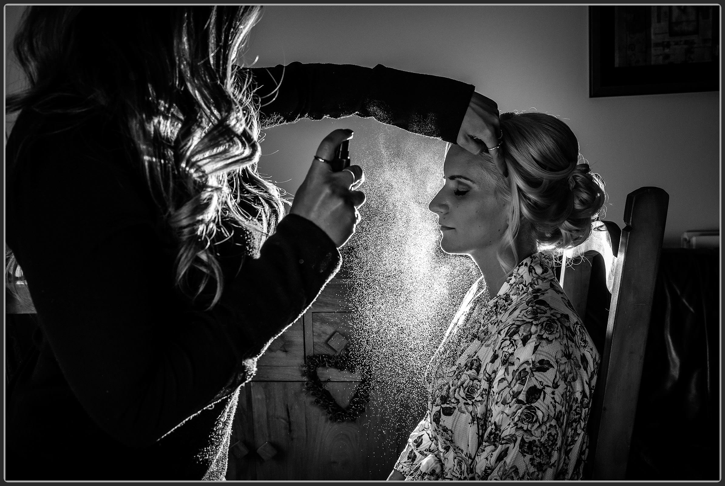 The bride having her makeup done