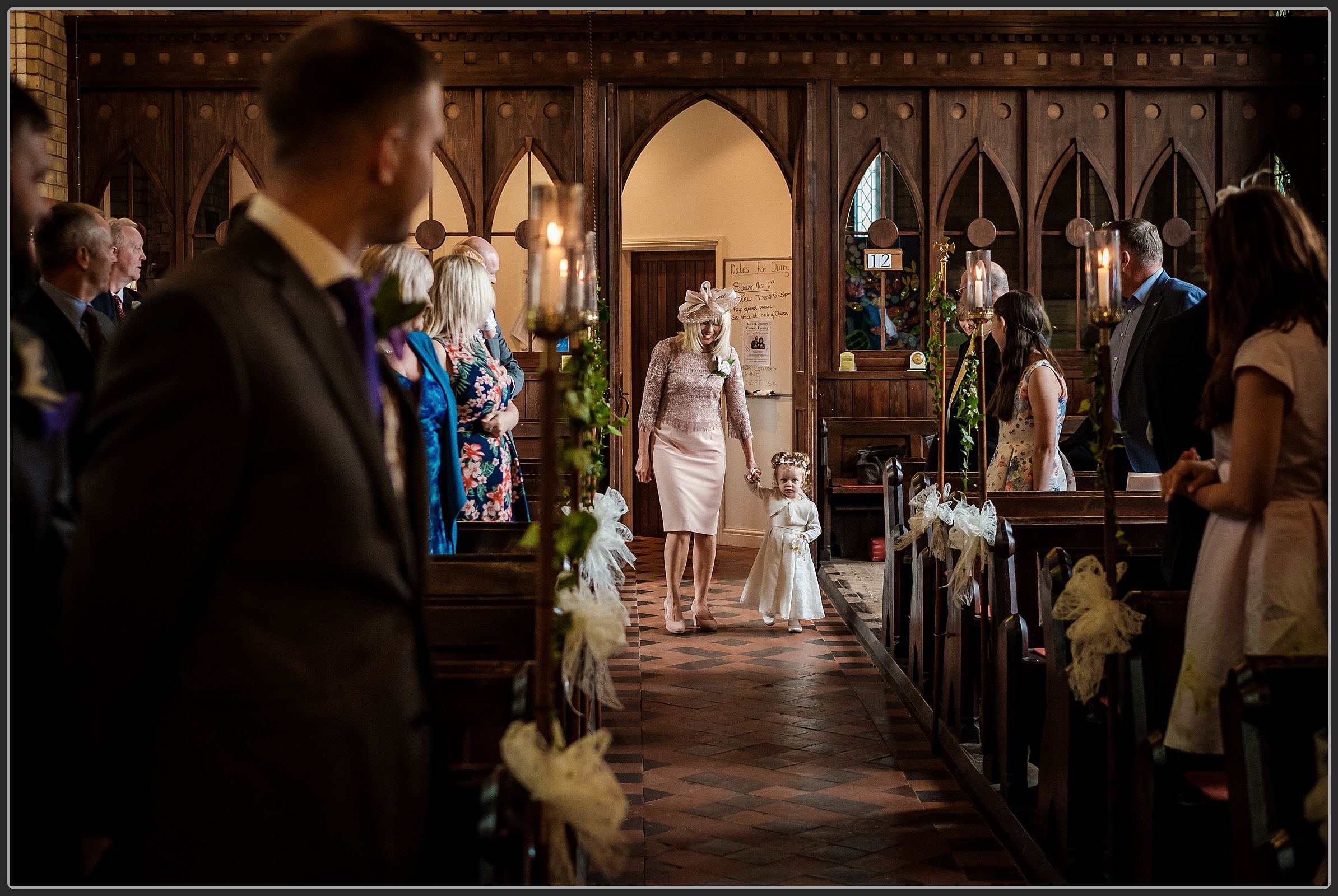 Brides mother walking down the aisle