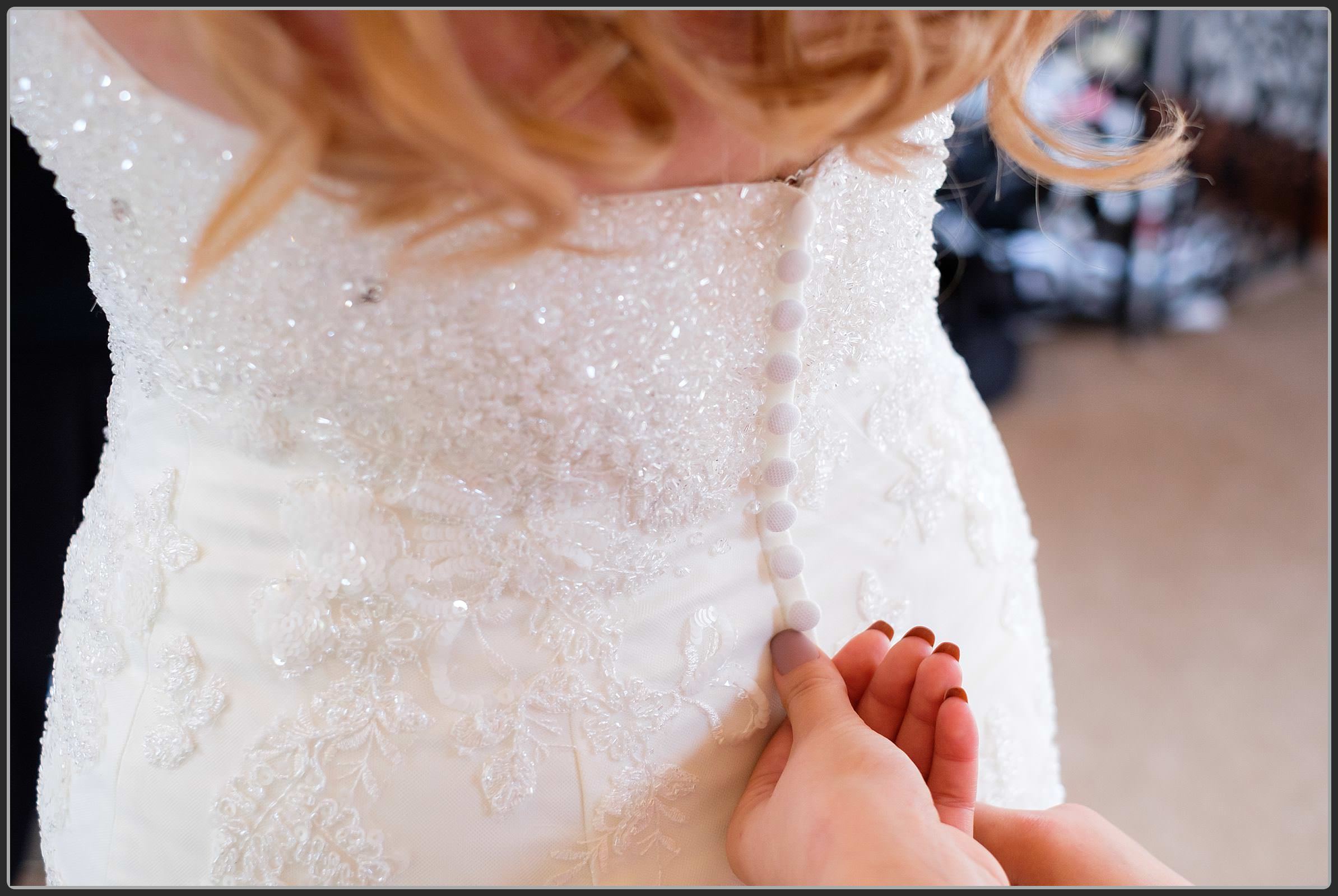 Wedding dress getting done up