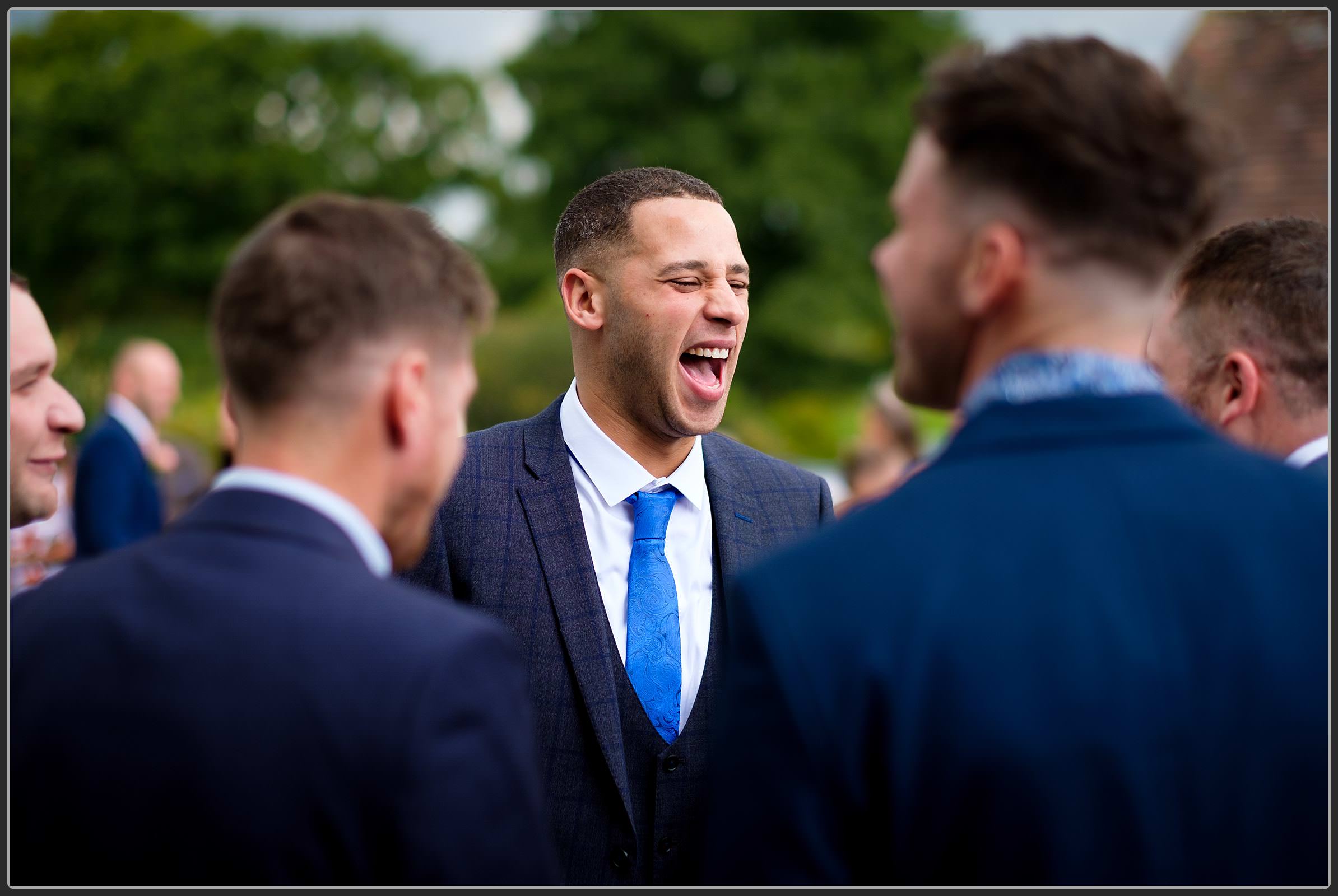 Wedding guests laughing