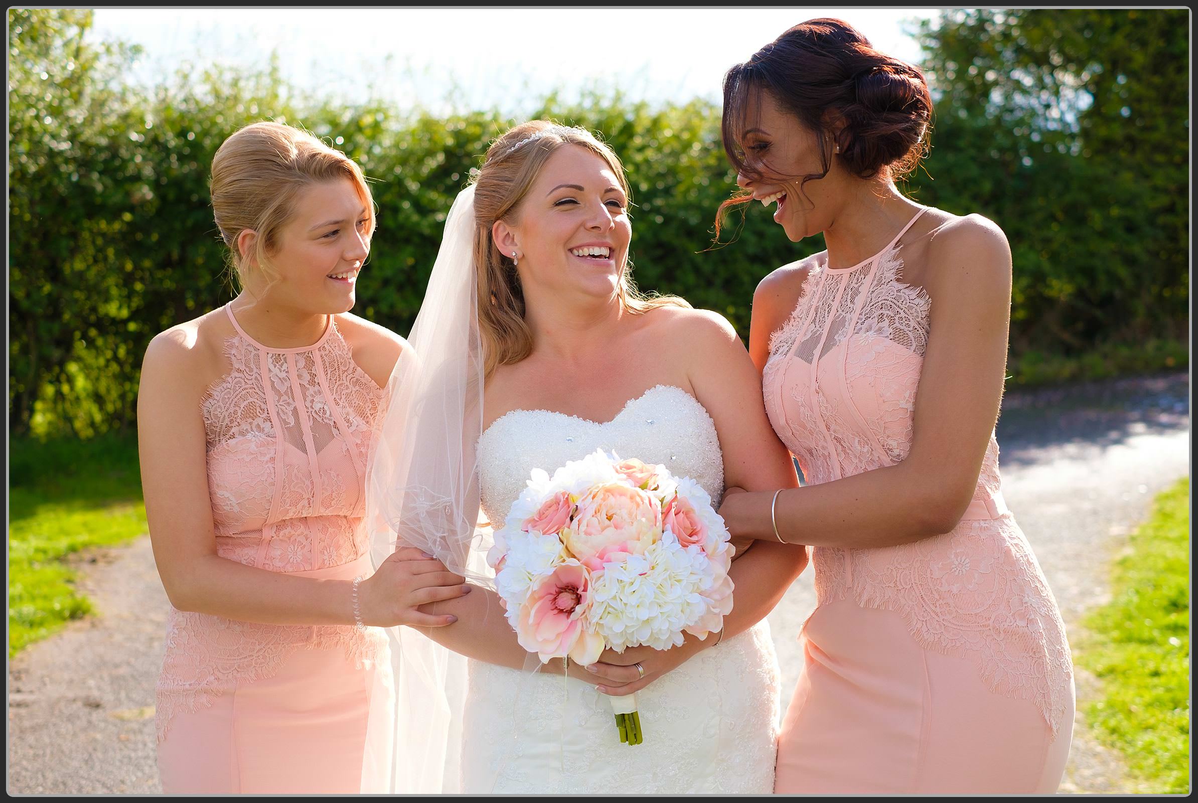 Bride and her bridesmaids laughing