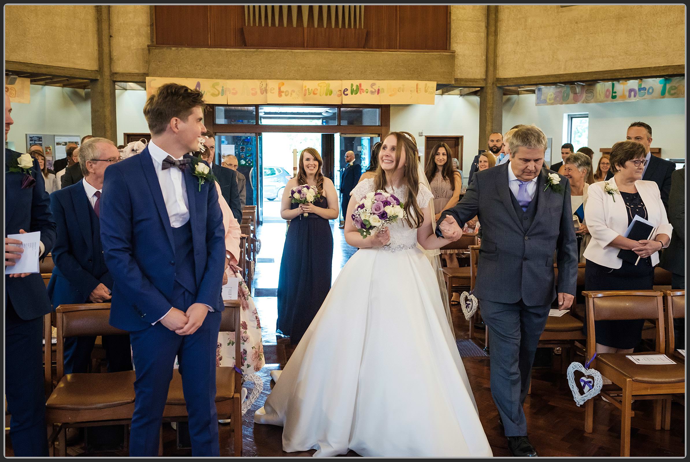 The bride walking down the aisle