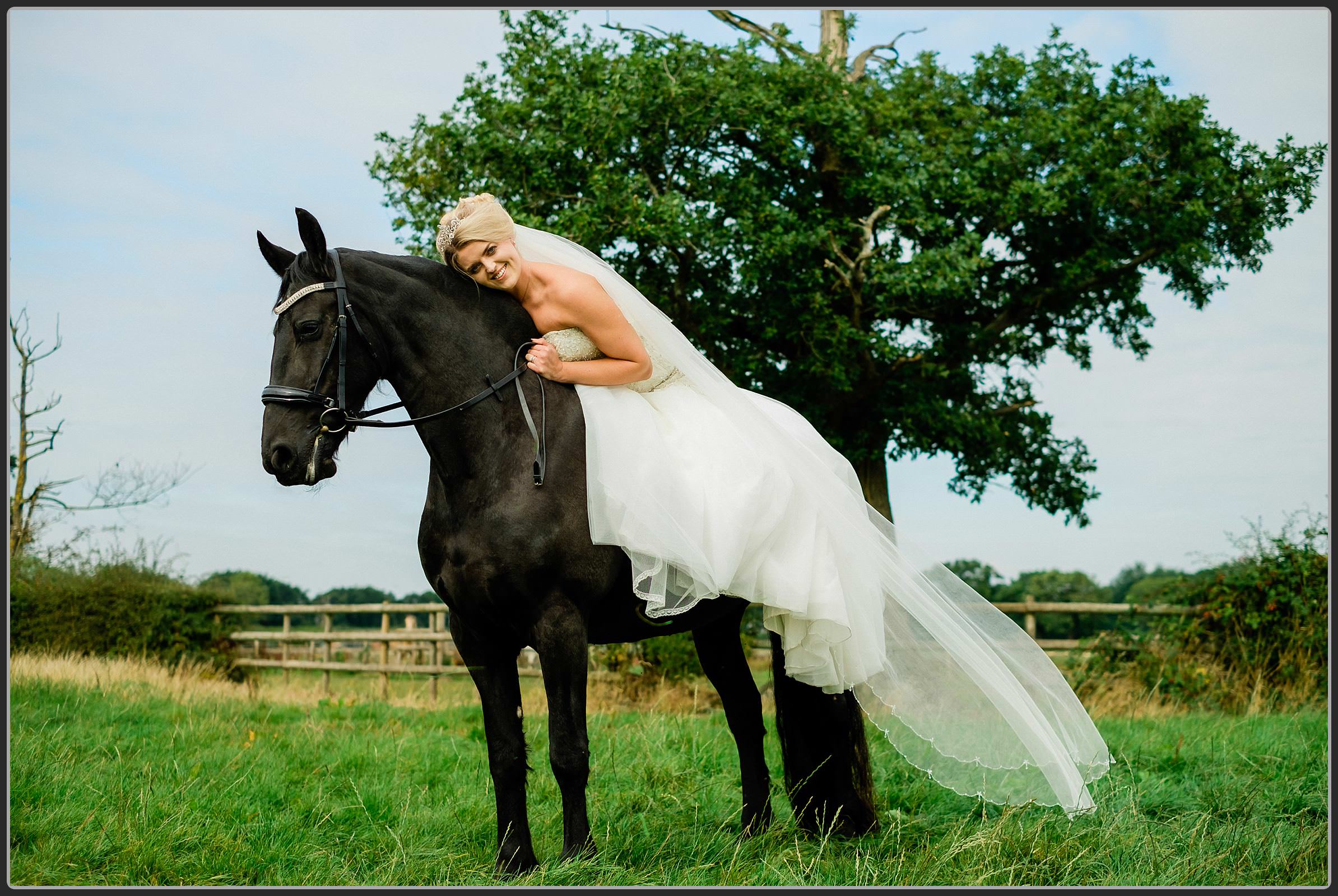 Bride wearing her dress on her horse