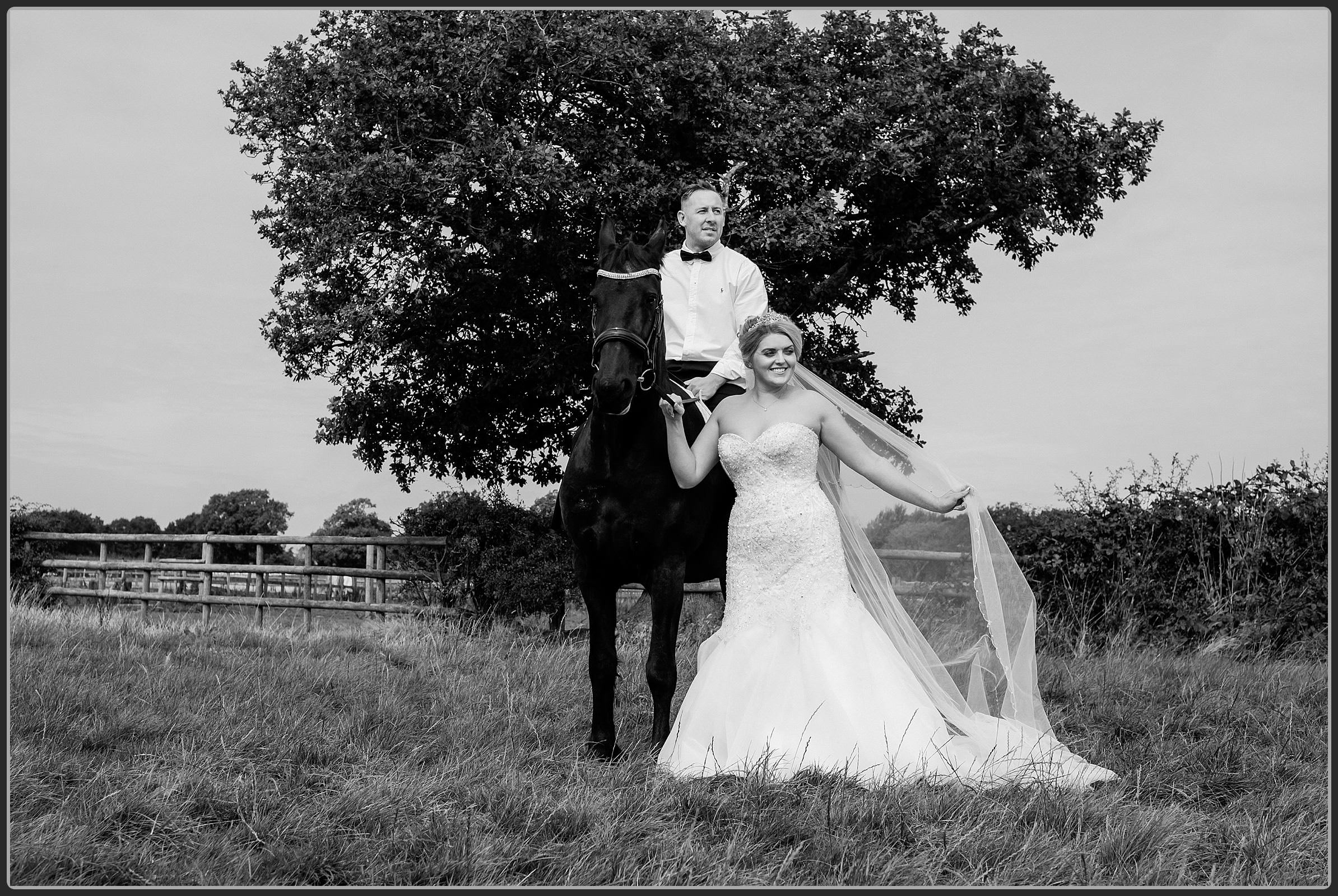 Bride and groom with the brides horse