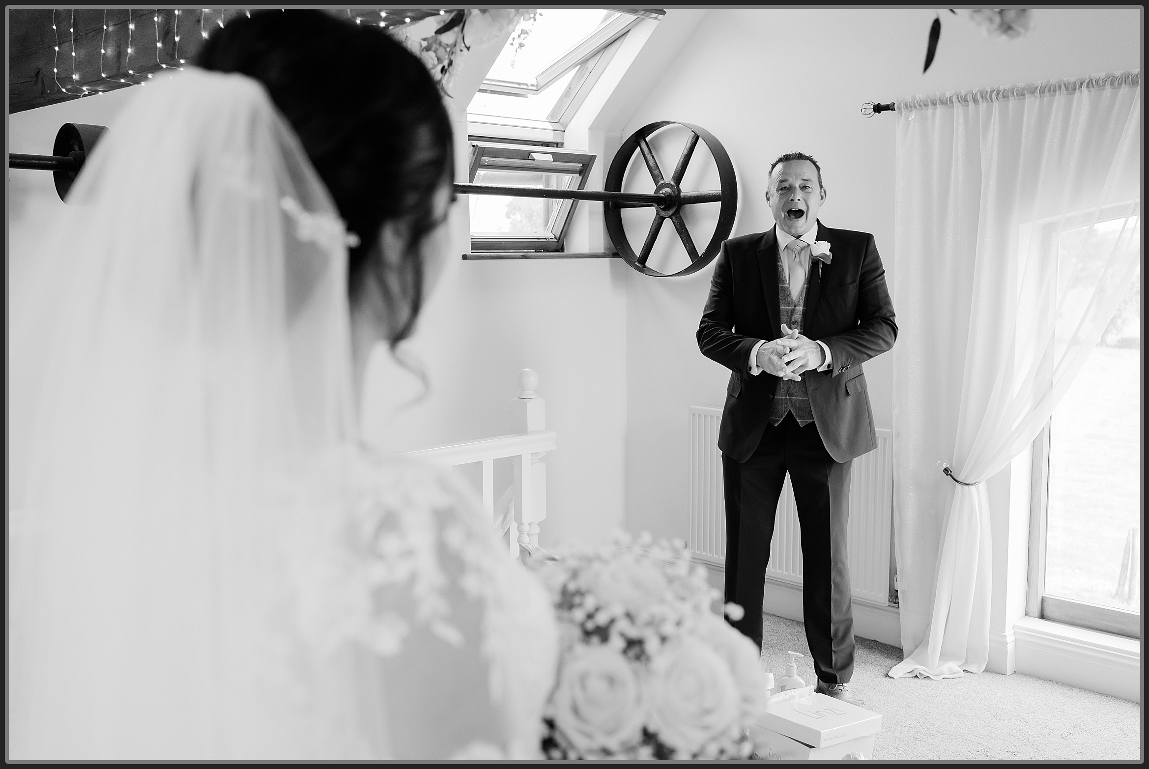 Father seeing his daughter for the first time in her wedding dress