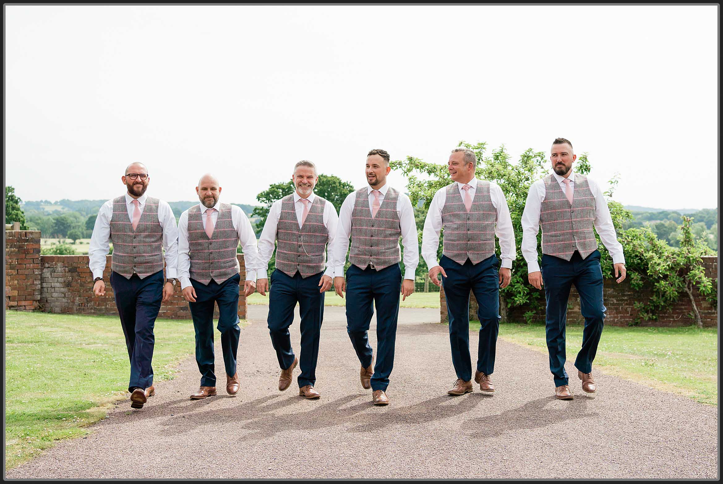 The groom and groomsmen walking