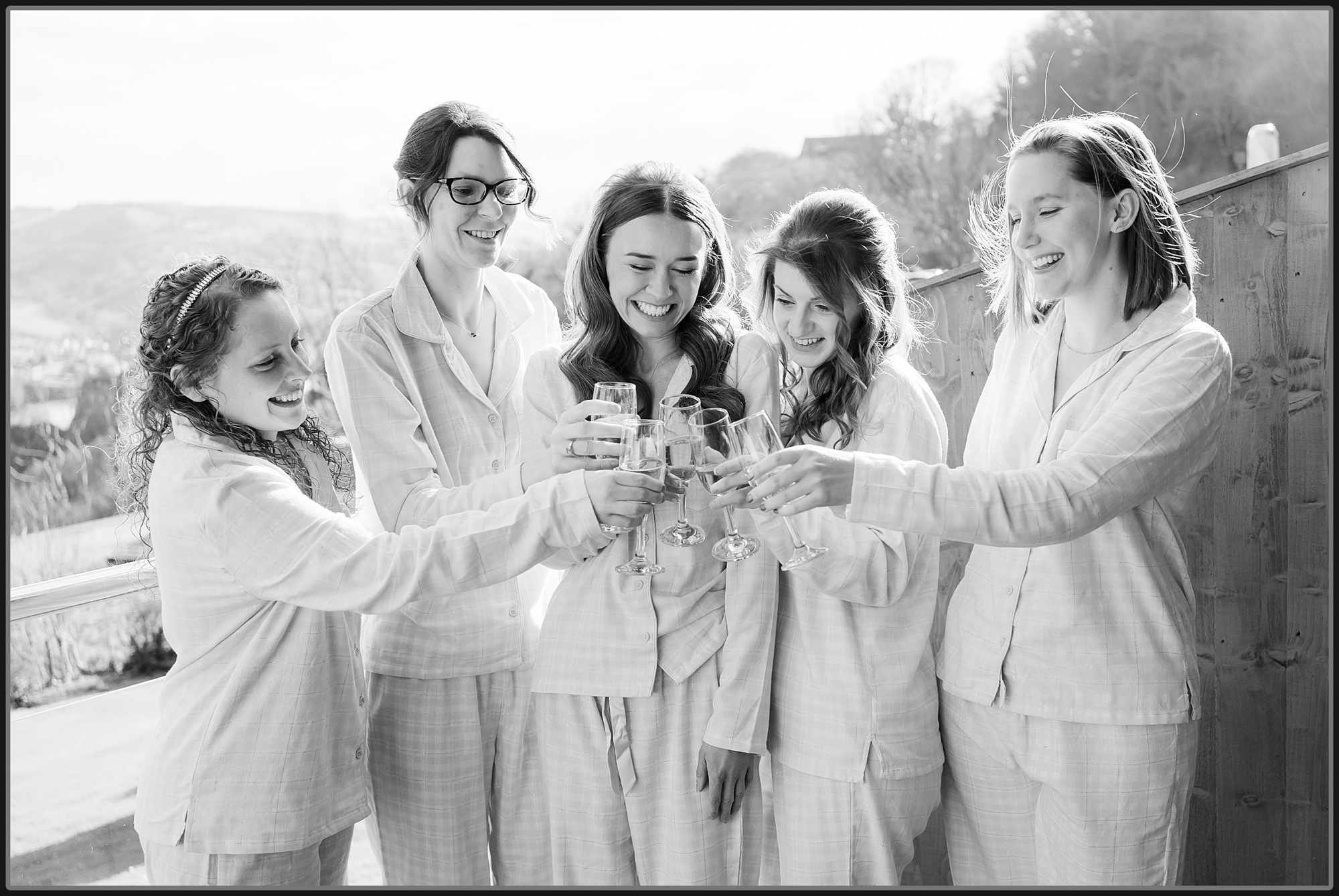 Bridesmaids cheering with champagne