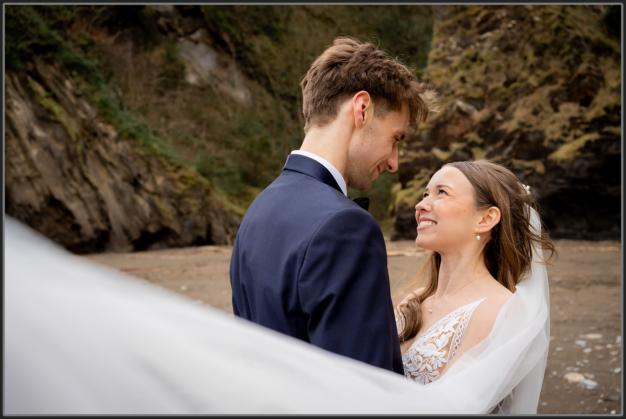 Bride and groom together on the beach