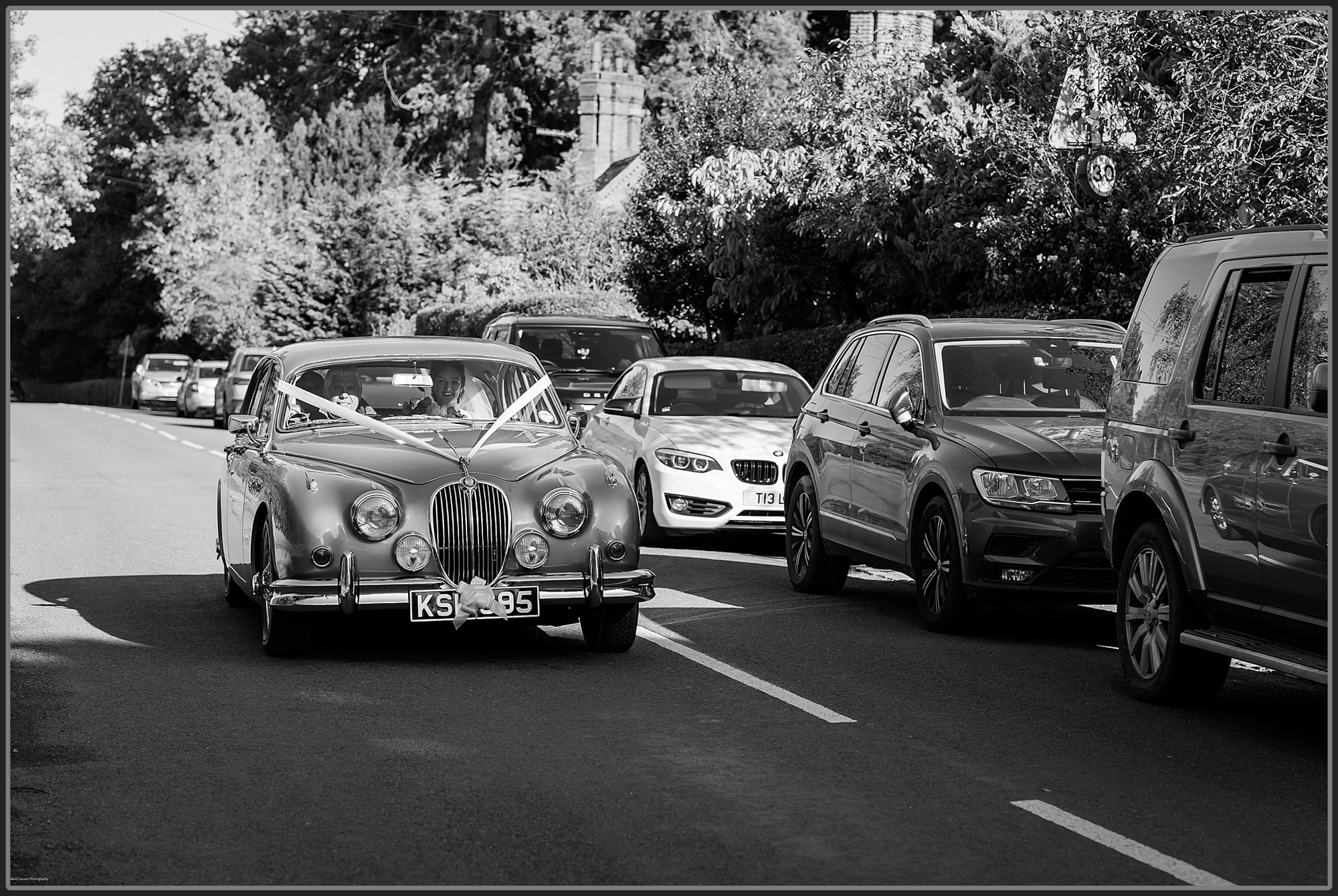 Bride and her father arriving in the wedding car