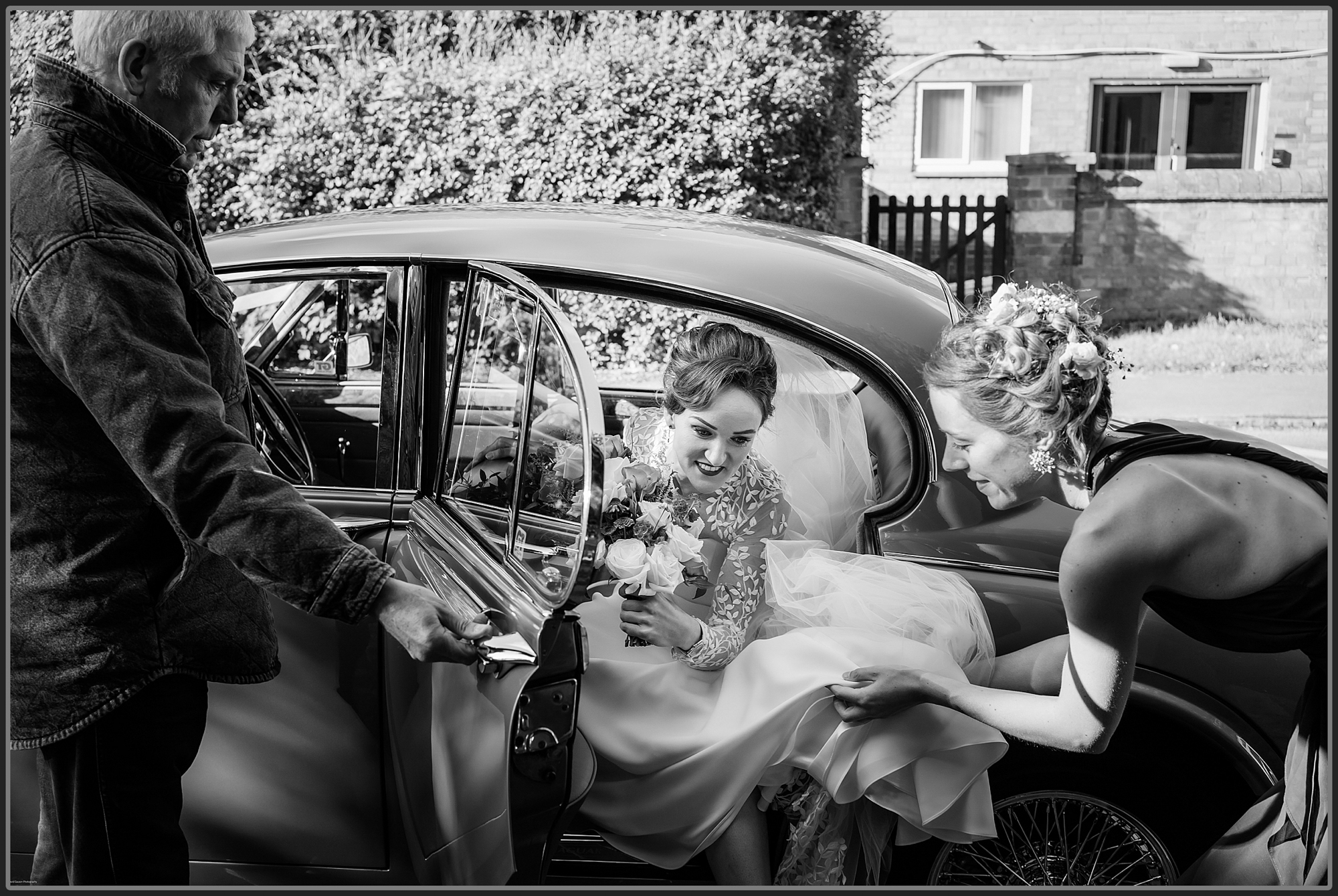 Bride getting out of the wedding car