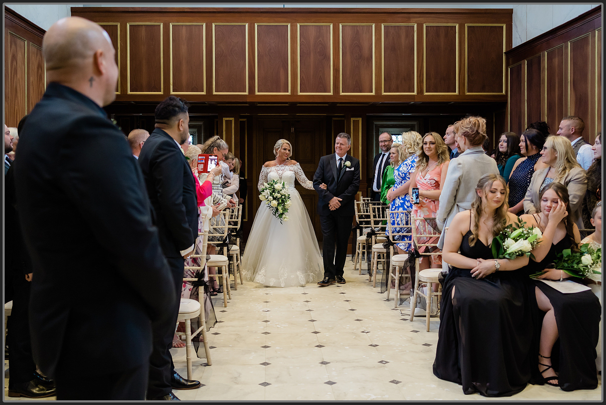 Bride and her dad entering the ceremony room