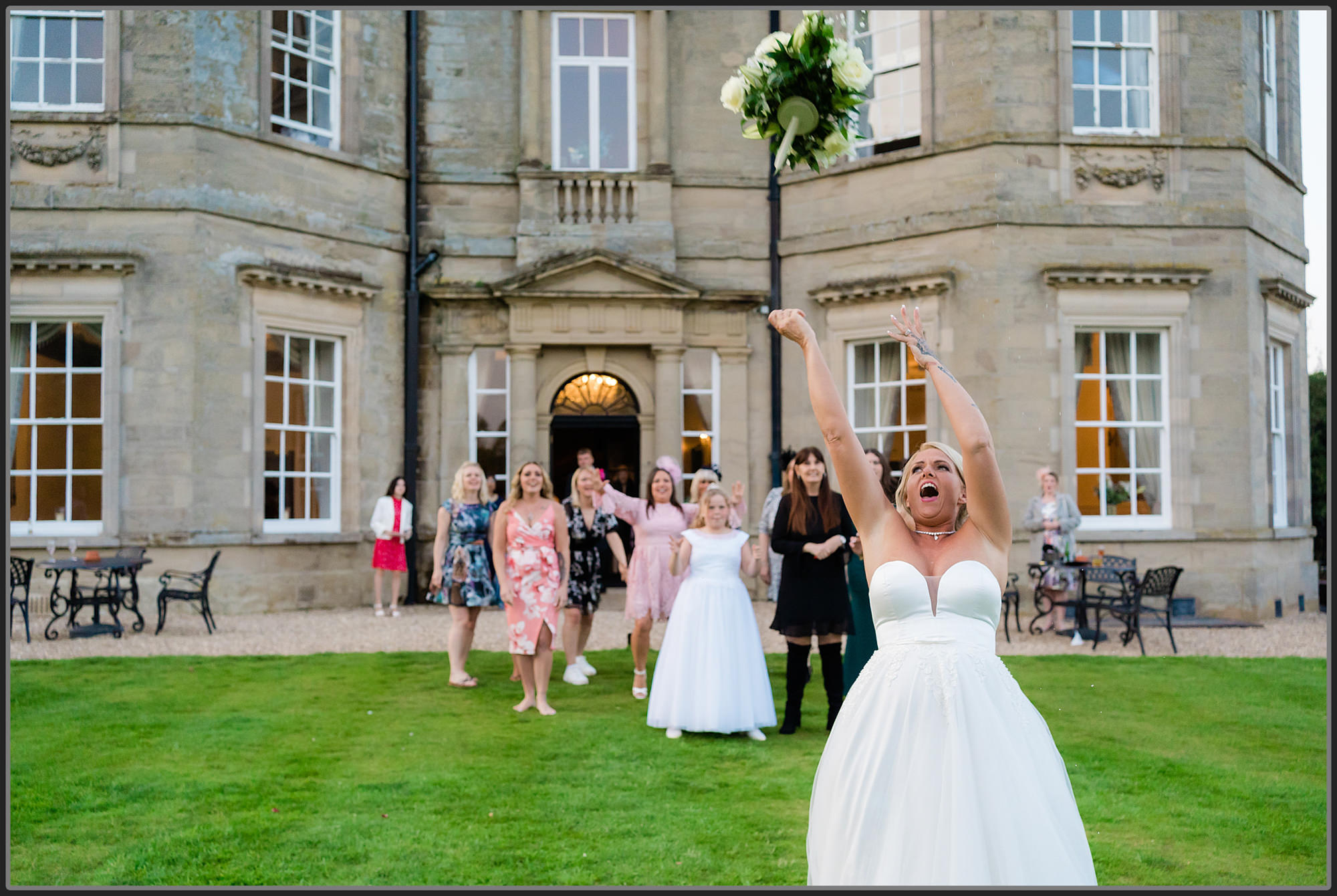 Bouquet toss by the bride