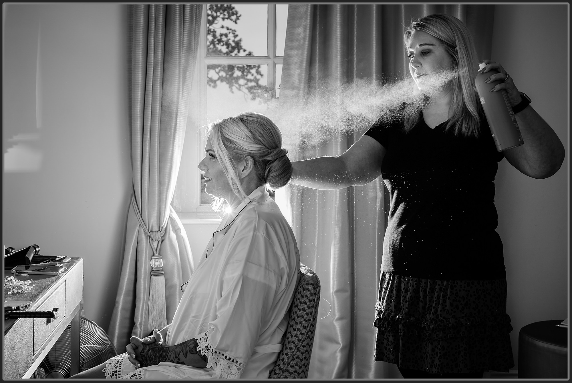 Hair and makeup being done at Bourton Hall during bridal prep