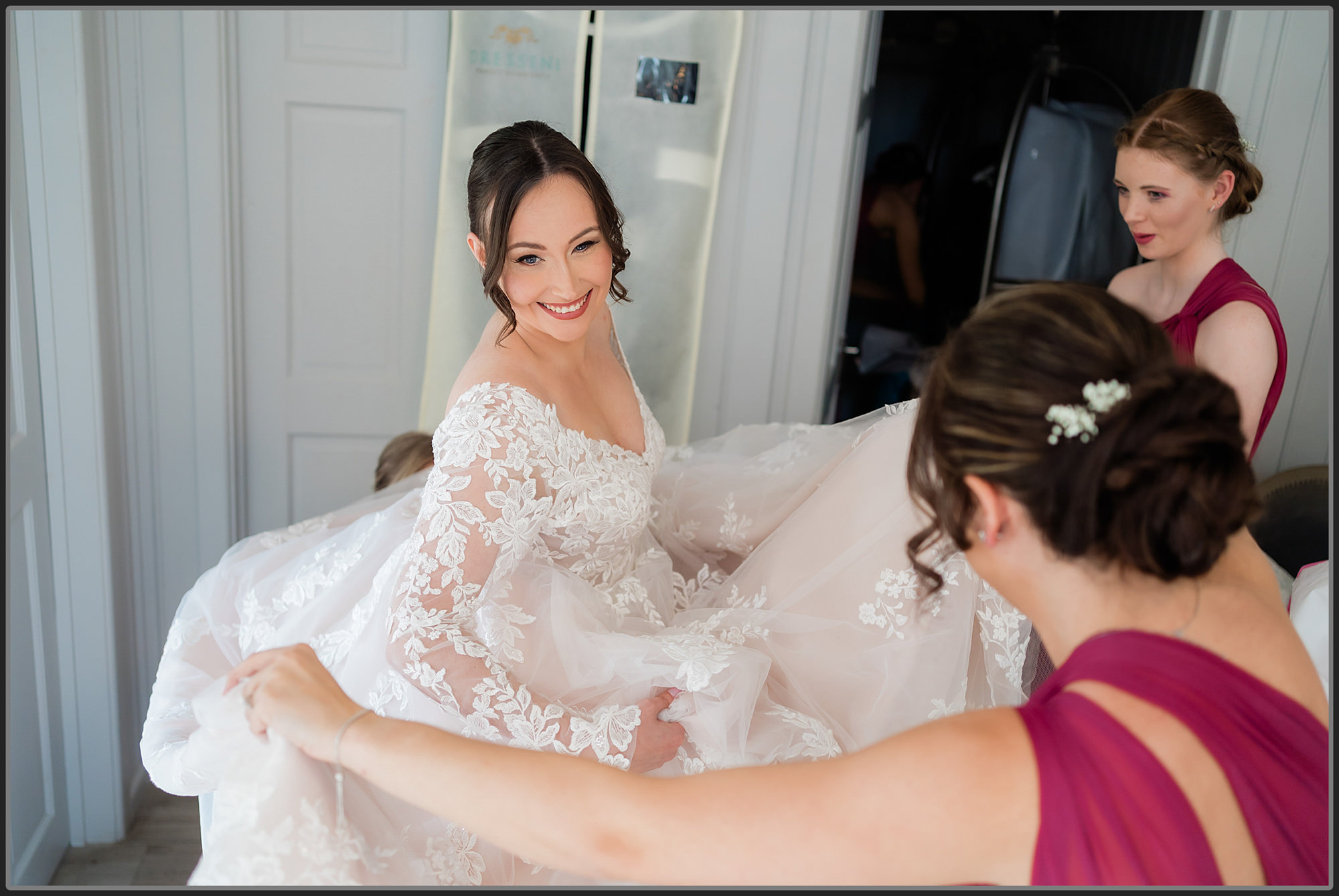 The bride in her wedding dress during the bridal preparation