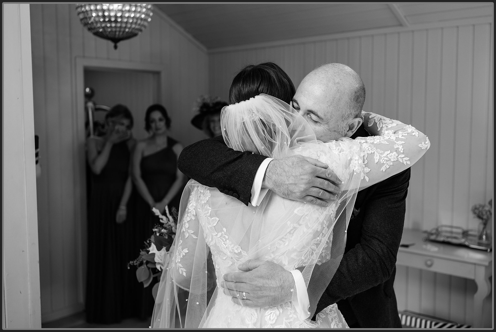 The bride and her father hugging