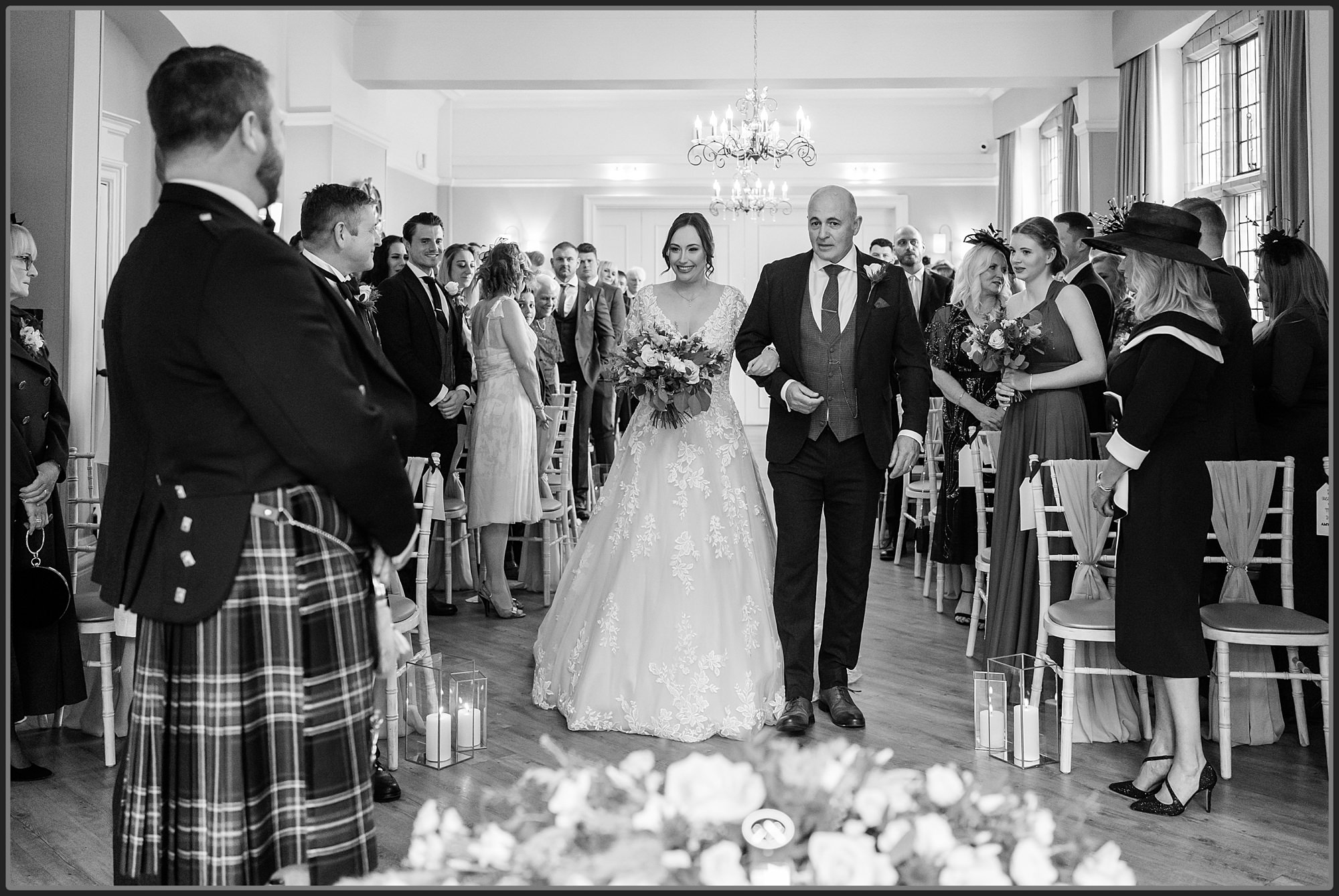 Bride and her father walking down the aisle at Moxhull Hall Hotel