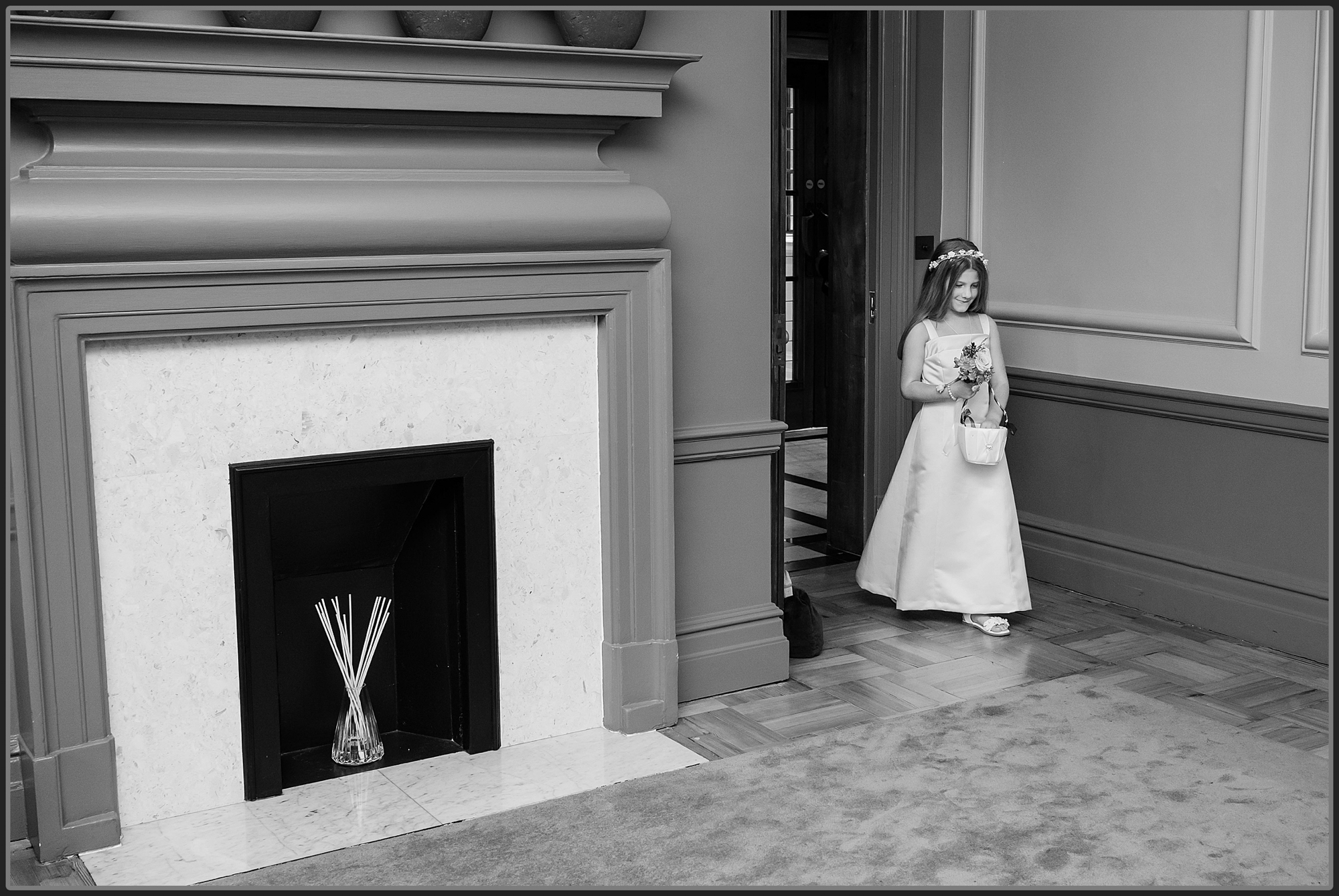 The flower girl walking into the ceremony