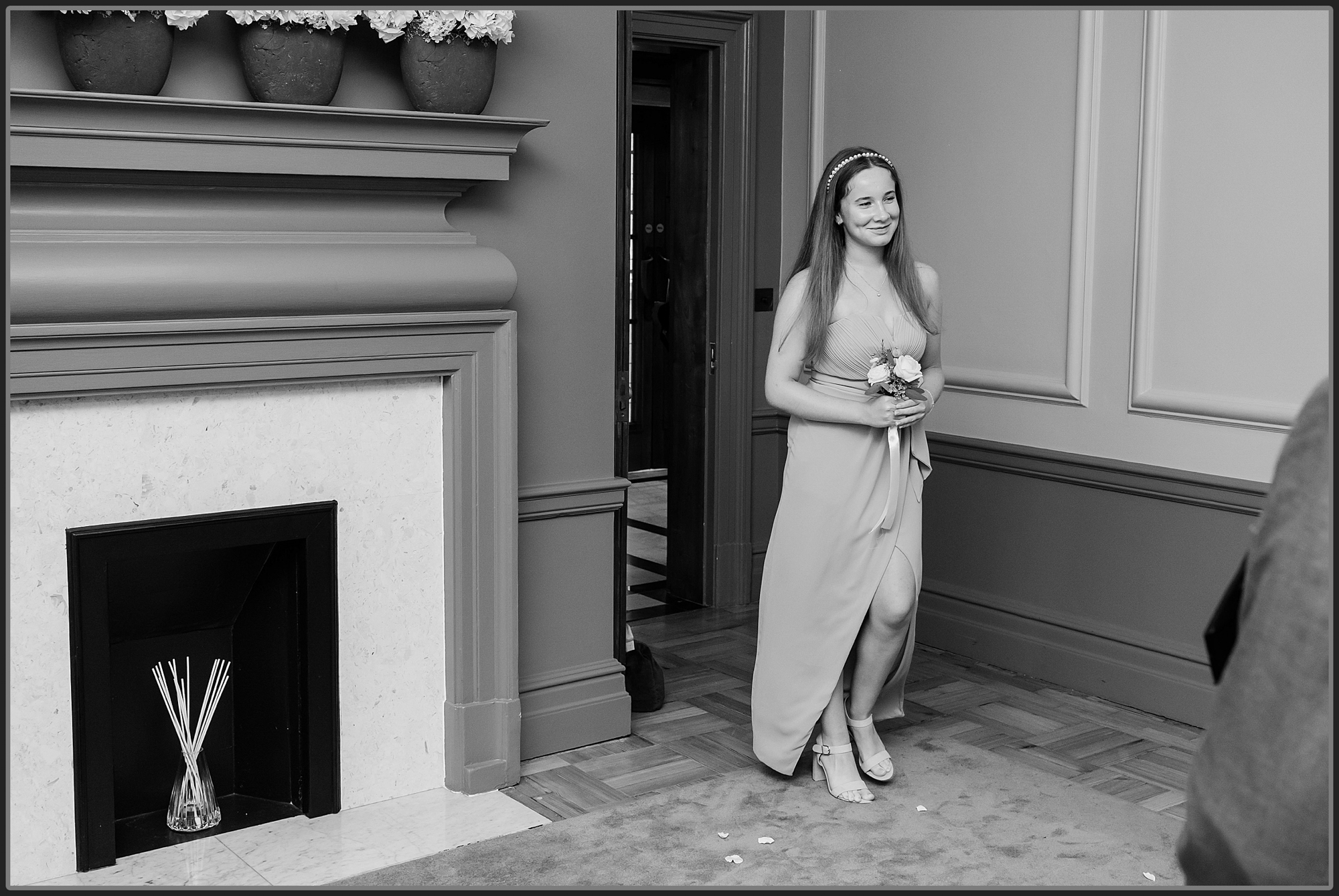 The bridesmaid walking into the ceremony at the Old Marylebone Town Hall