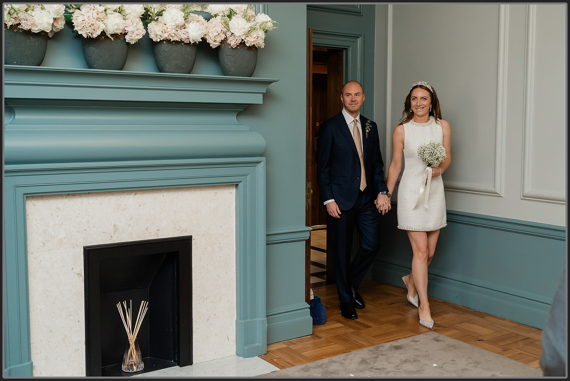 Bride and groom walking in the ceremony at Old Marylebone Town Hall